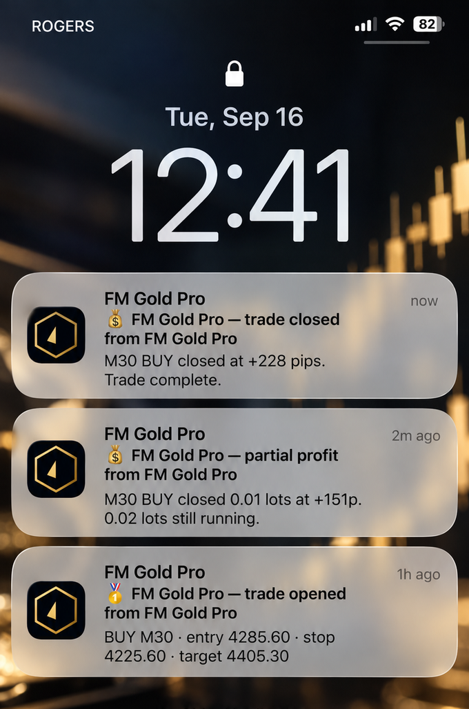 FM Gold Pro trade notifications shown on a phone lock screen